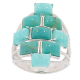 Emerald blue turquoise sterling silver ring featuring a unique design and multiple turquoise gemstones.